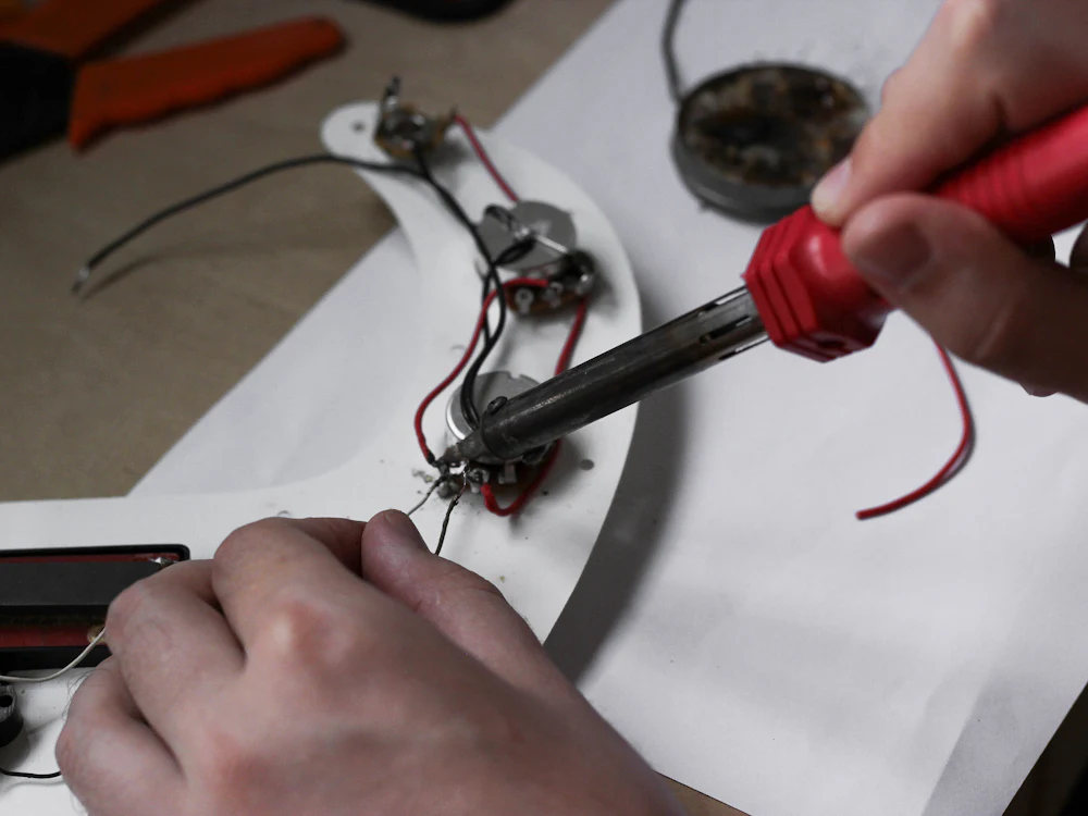 Technician testing an electronic assembly on a workbench